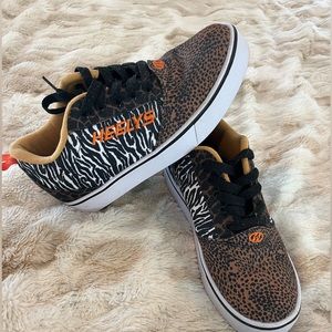 Womens size 8 Heely’s.